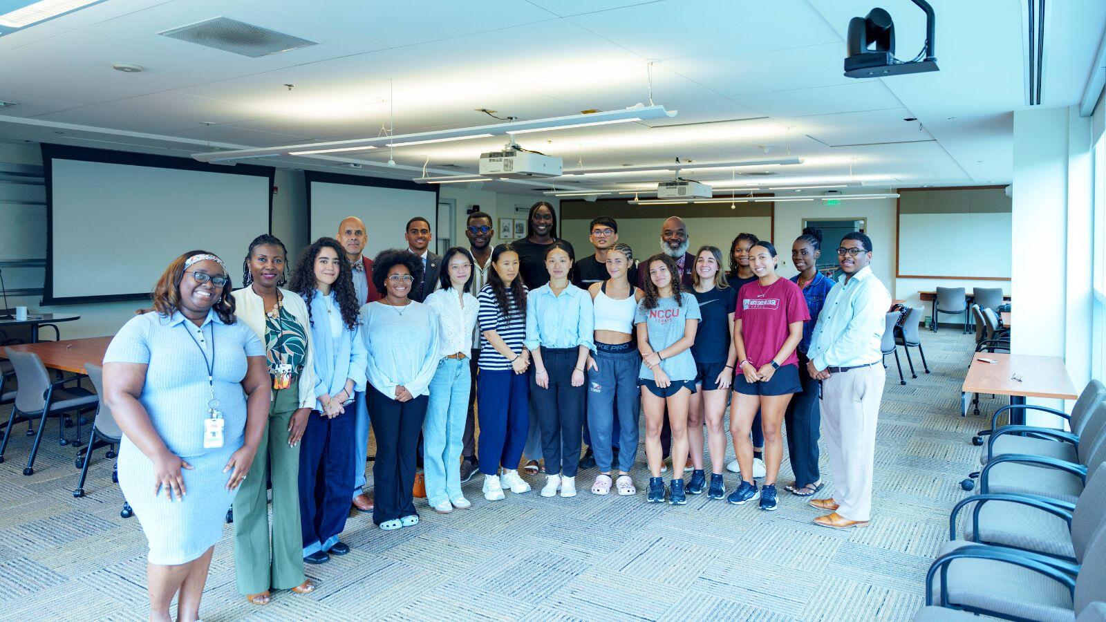 Students, faculty, and staff pose for a group photo after an academic or cultural exchange event.