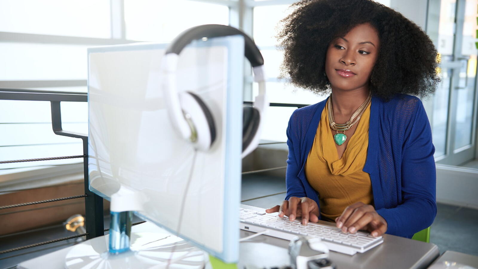 Woman sitting in front of a computer