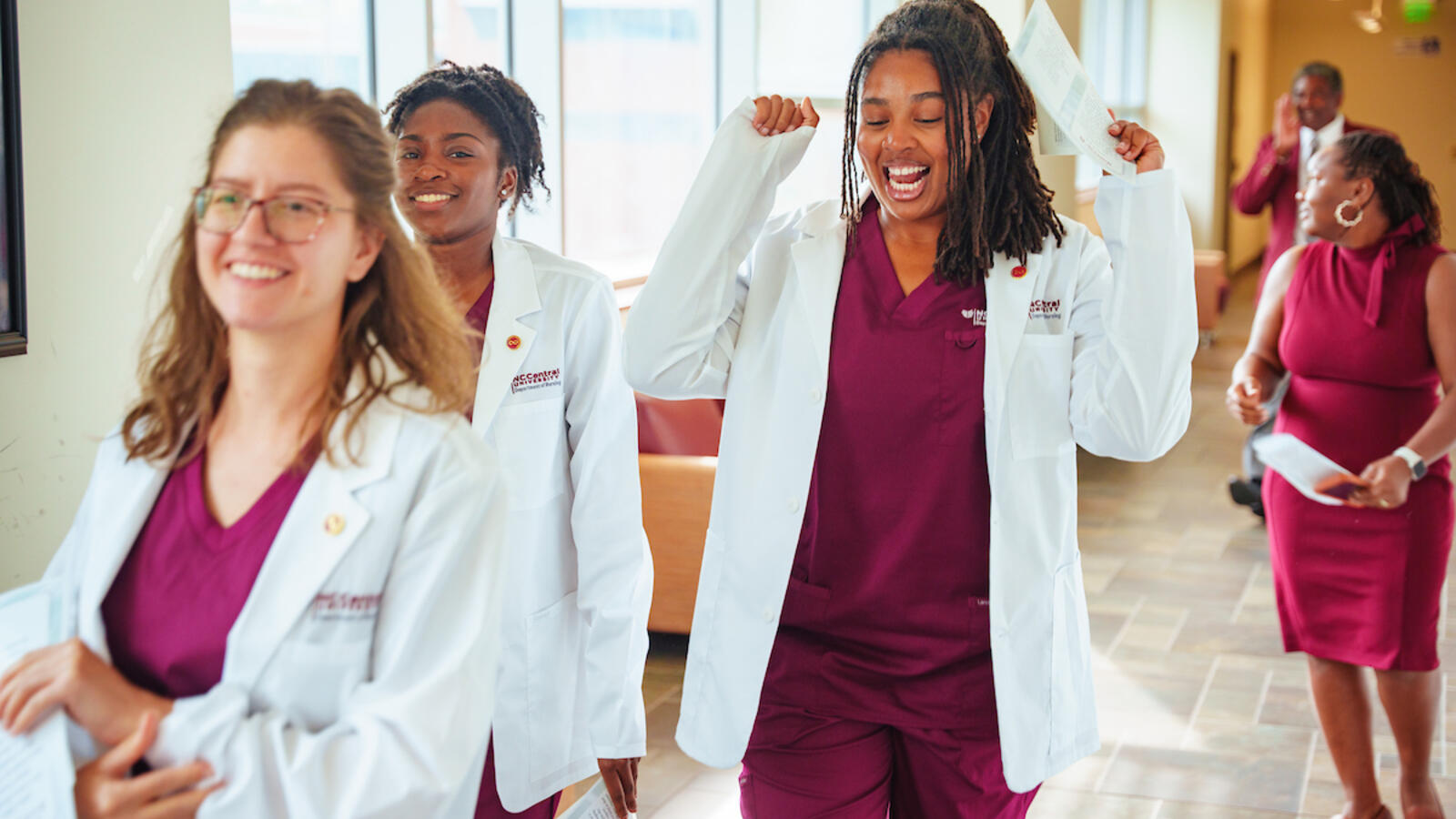 Nursing students walking in a hallway