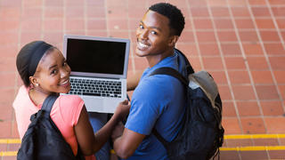 Students Sitting on Steps Smiling