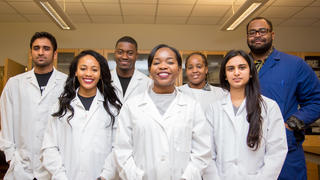 Students smiling facing camera