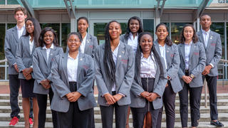 Students standing outside on stairs