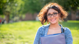 Student outride smiling