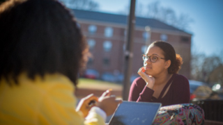 Student sitting by window