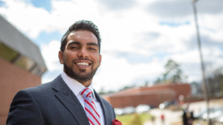 Student smiling outside