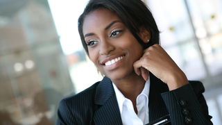 Business Woman smiling at the camera.