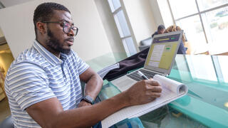 Portrait of man working on a computer.