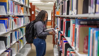 NCCU student in the library