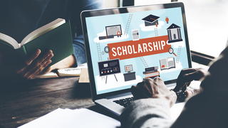 Laptop displaying a scholarship ad