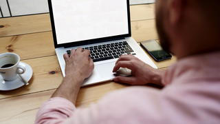 Guy working on Computer