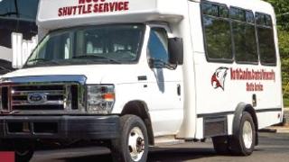 NCCU Shuttle Service Bus parked.