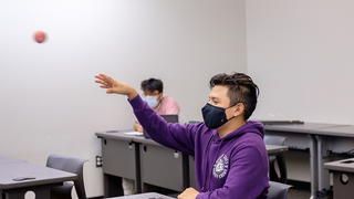 Student inside classroom throughout a ball