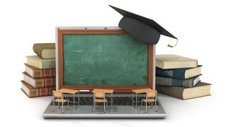 Shrunken desks and blackboard, with regular-sized books