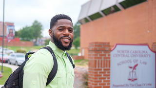 Student outside of School of Law building