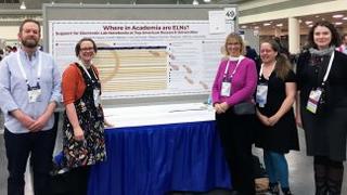 Julie Kelly, third from left, with colleagues at conference presentation. (Photo credit: University of Minnesota Libraries)
