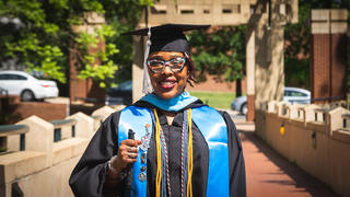graduate Christie Smith in front of School of Education