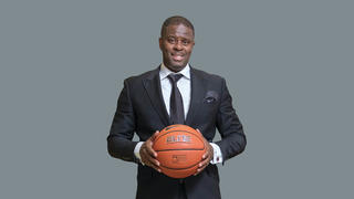 Basketball Coach LeVelle Moton holding a basketball