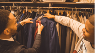 Students picking out a suit.