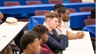 Students attending a conference.