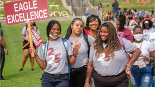 students holding signs