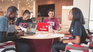 Students smiling at eachother