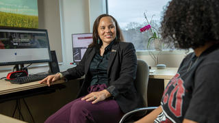 Two women having a conversation in an office