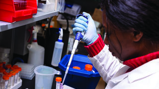 Woman using a pipette