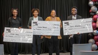 recipients receiving checks for winning competition