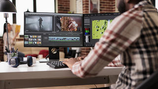 young man editing film 