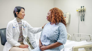 Doctor placing hand on the shoulder of a patient