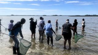 Dr. Caresse Gerald, fourth from left, takes a photo during a recent field trip to Carteret County with her students from N.C. Central University.