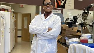 Assistant Professor Carresse Gerald in a laboratory.