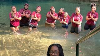 NCCU student post in water.