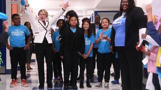 State Superintendent Catherine Truitt celebrates with Principal Aisa Cunningham