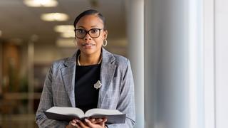 Ashley Pointe holds book in School of Law