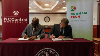 NCCU chancellor and Durham Tech president signing MOU agreement for Eagle Connect Program