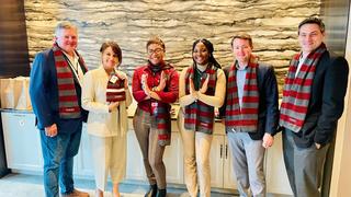 Aramark CEO Jack Donovan, Human Resources VP Jenn Radice, CFO Rich Kotzker and Regional VP Matt Rogers congratulate NCCU students, Aamira Southerland and Jalaysha Tucker.