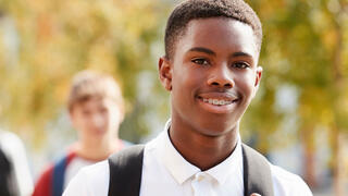 student with backpack