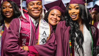 A group of graduates posing for a picture