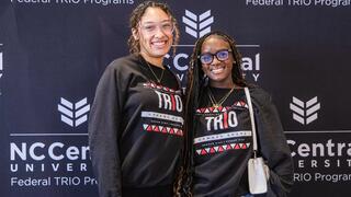Two female students smiling.