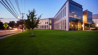 NCCU Student Center Building at dusk with vehicle traffic
