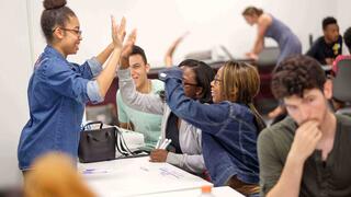 students high fiving