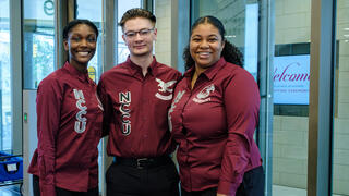 Students in maroon shirts at School of Business