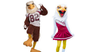 North Carolina Central University mascots Eddie the Eagle and Annie the Eagle pose together in NCCU maroon and gray spirit attire, representing Eagle pride and school spirit.