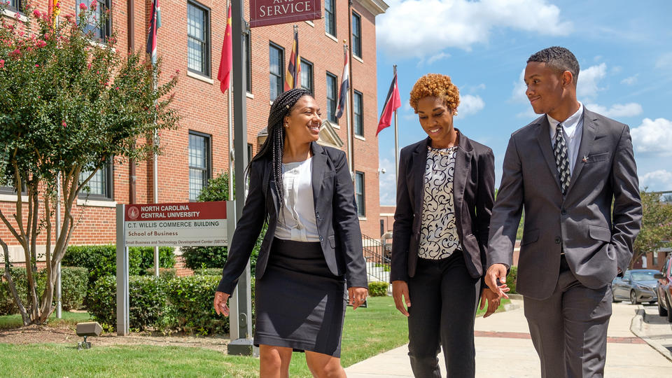 School of Business students walking outside.