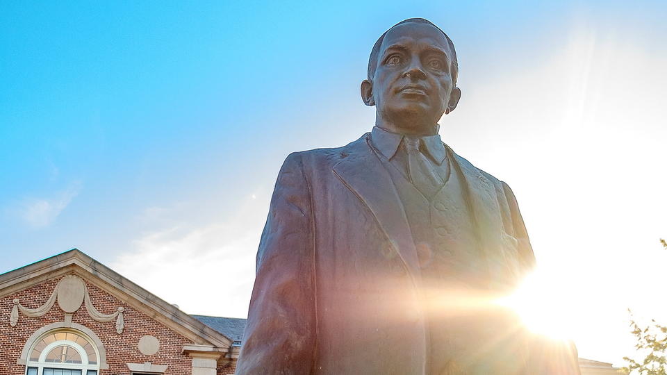 James E. Shepard Statue with Administration building in background.