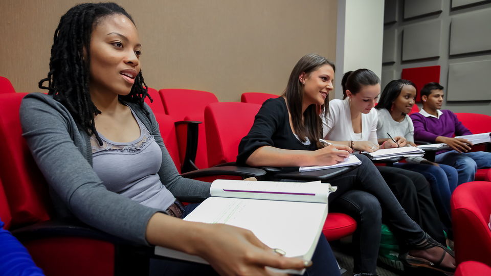 Students sitting in a classroom.