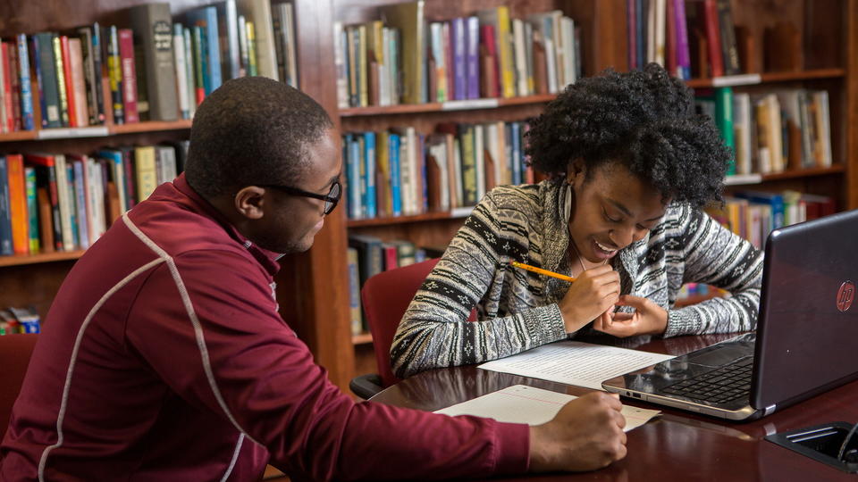 Tutor helping a student.