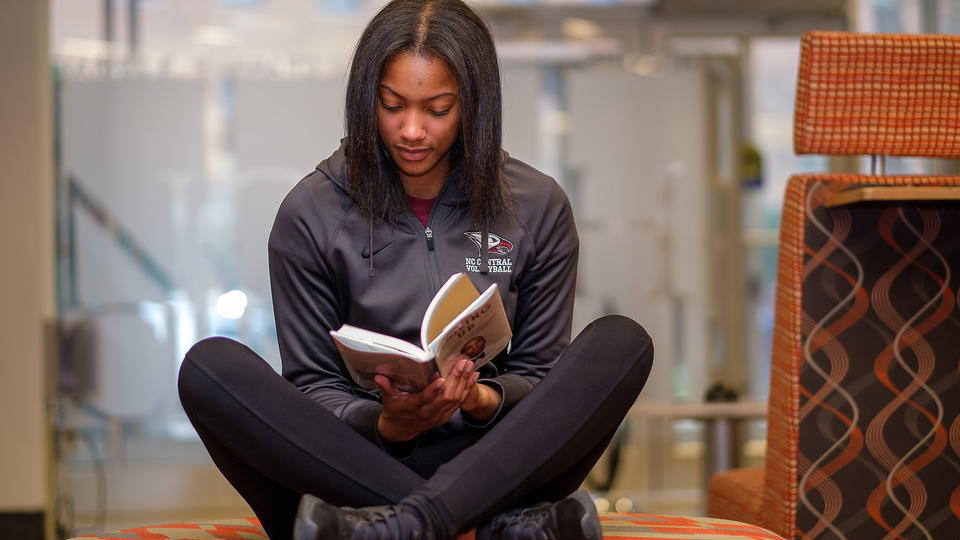 Student Sitting with a book