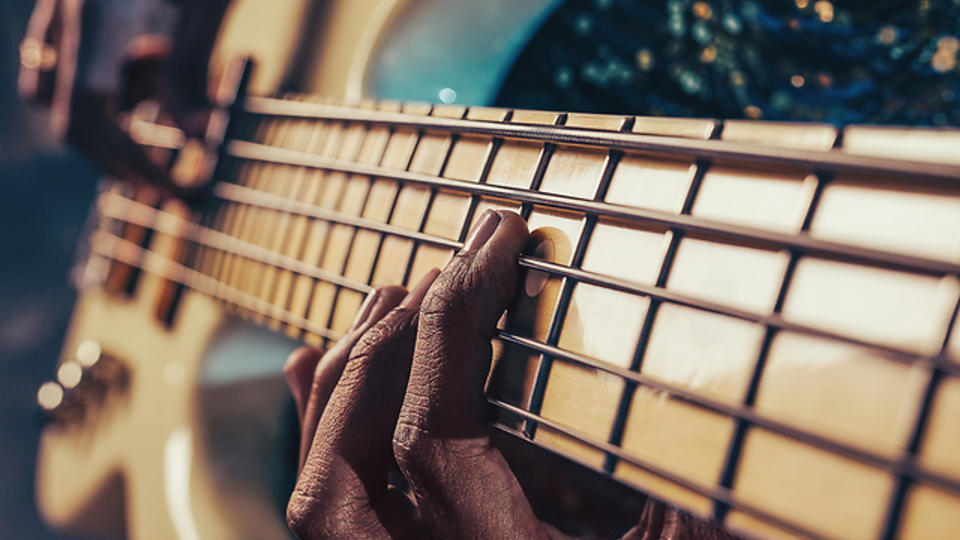Hands playing guitar